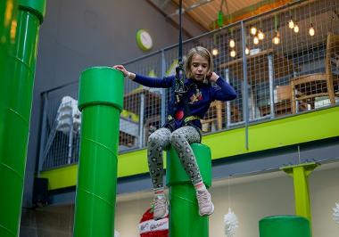 Girl enjoying clip n climb activity