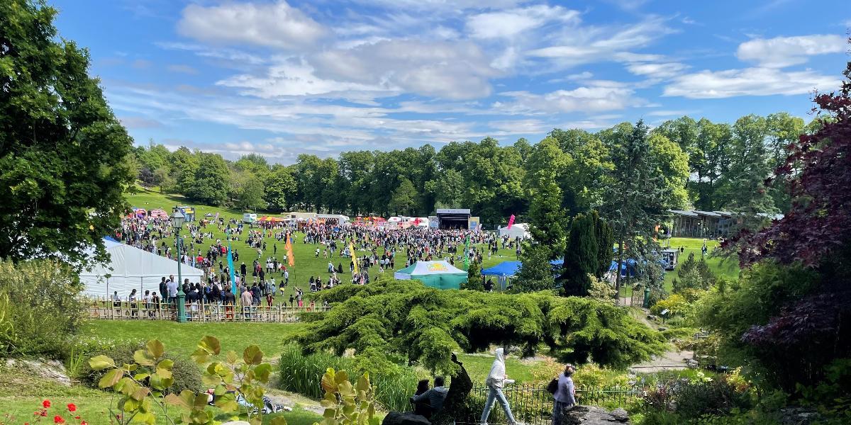 City Events 2023 Avenham Park event banner image Avenham Park Mela event in the distance and Japanese Gardens close up