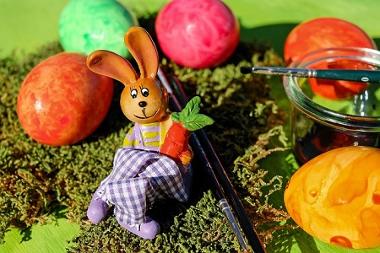 Easter bunny with eggs and paint brushes