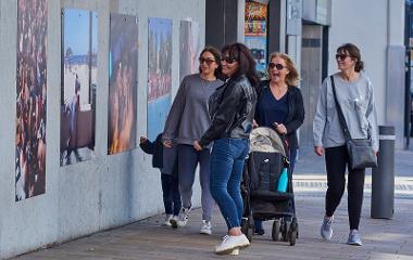 Women enjoying photography in a public space