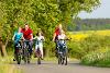 Family cycling on path
