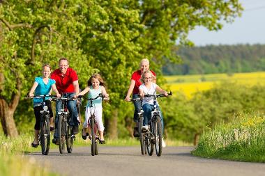 Family cycling on path