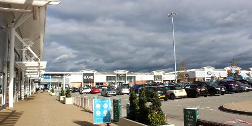 Stores and cars at Deepdale Shopping Park, Preston.