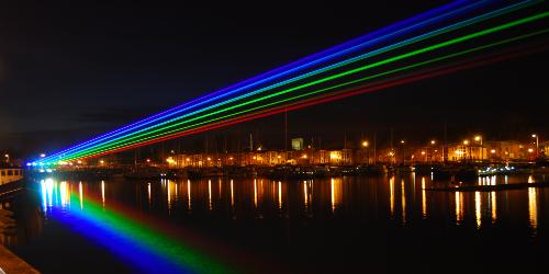 Rainbow laser light display in the sky at Preston Docks for Guild 2012 celebration.