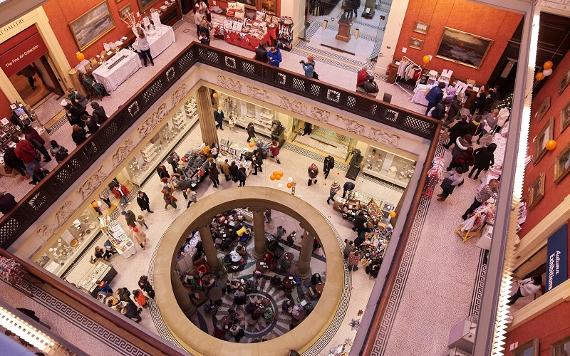 Shoppers browsing stalls at craft market inside the Harris, Preston.