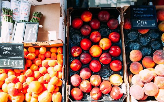 Fresh fruit and vegetables on sale at market stall.