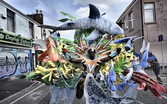 Man in costume during Preston Caribbean Carnival 2018.