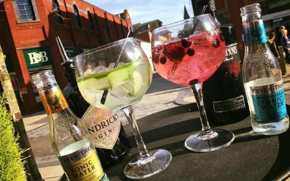Cocktails on Moka outdoor table on sunny day.