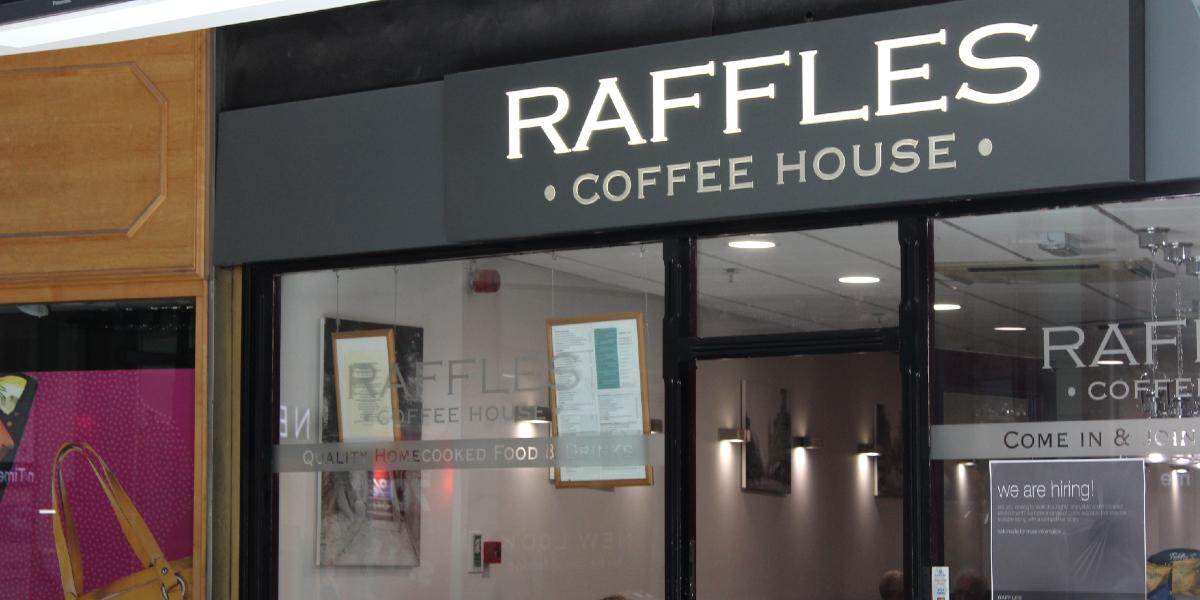 Main image: Exterior sign for Raffles Coffee Shop, Preston. Exterior sign for Raffles Coffee Shop, Preston.