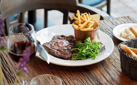 Bistrot Pierre's steak and chips on restaurant table.