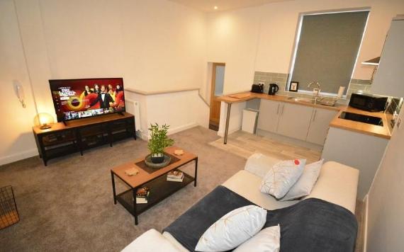 F.G. Aparthotel open plan living room and kitchen area.