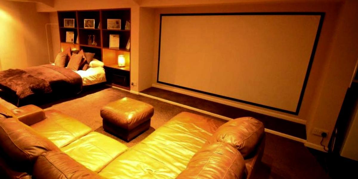 F.G. Preston city centre apartment with double bed, corner sofa, and large screen. F.G. Preston city centre apartment with double bed, corner sofa, and large projection screen.