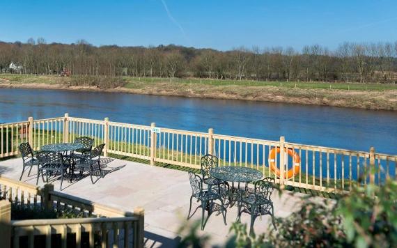 Outside dining area by the River Ribble at the Macdonald Tickled Trout Hotel.