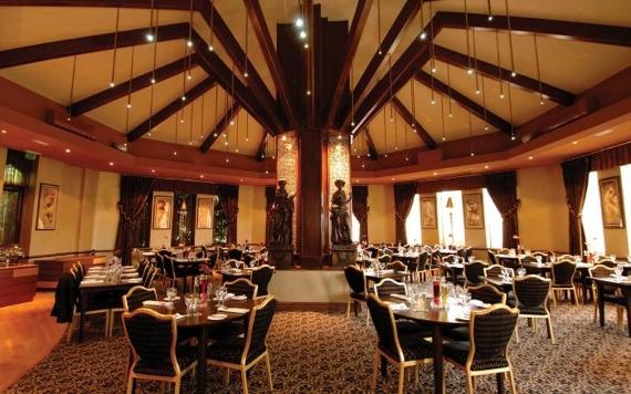 Preston Leyland Hotel round dining room lit by handing lights.