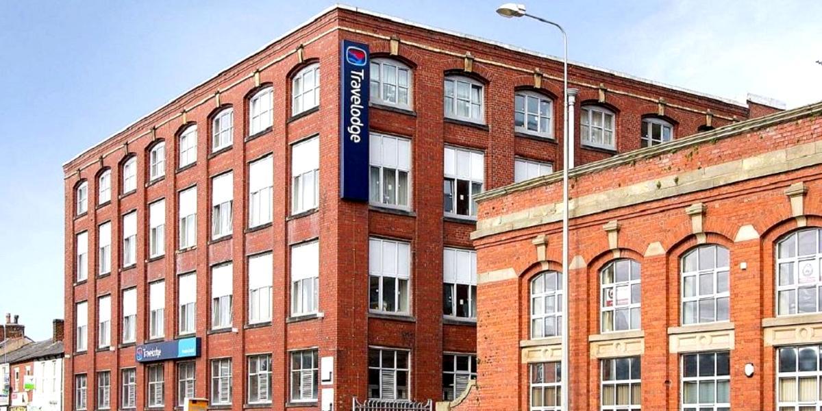Main image: Travelodge Preston Central hotel building in old mill. Travelodge Preston Central hotel building in old mill.