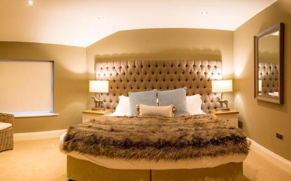 Luxury room with faux fur bed throw inside Winckley Square Hotel.