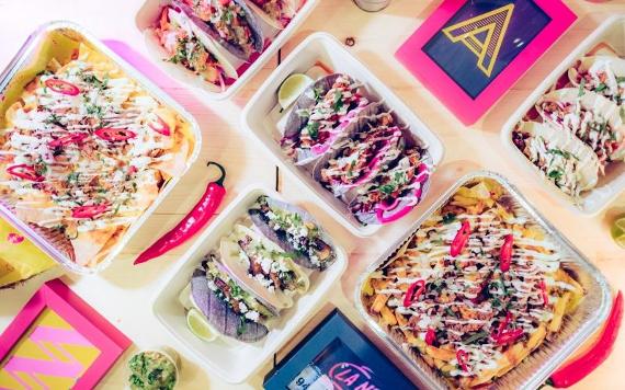 Colourful dishes from La Neta arranged on table.