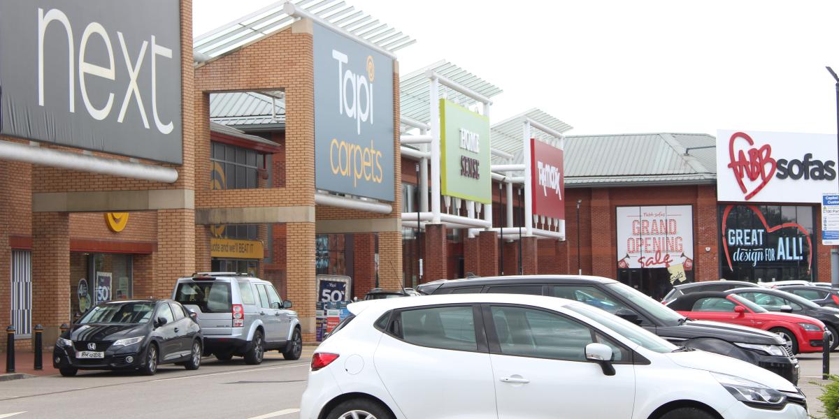 Shops and car park area of Capitol Centre Shopping Park.