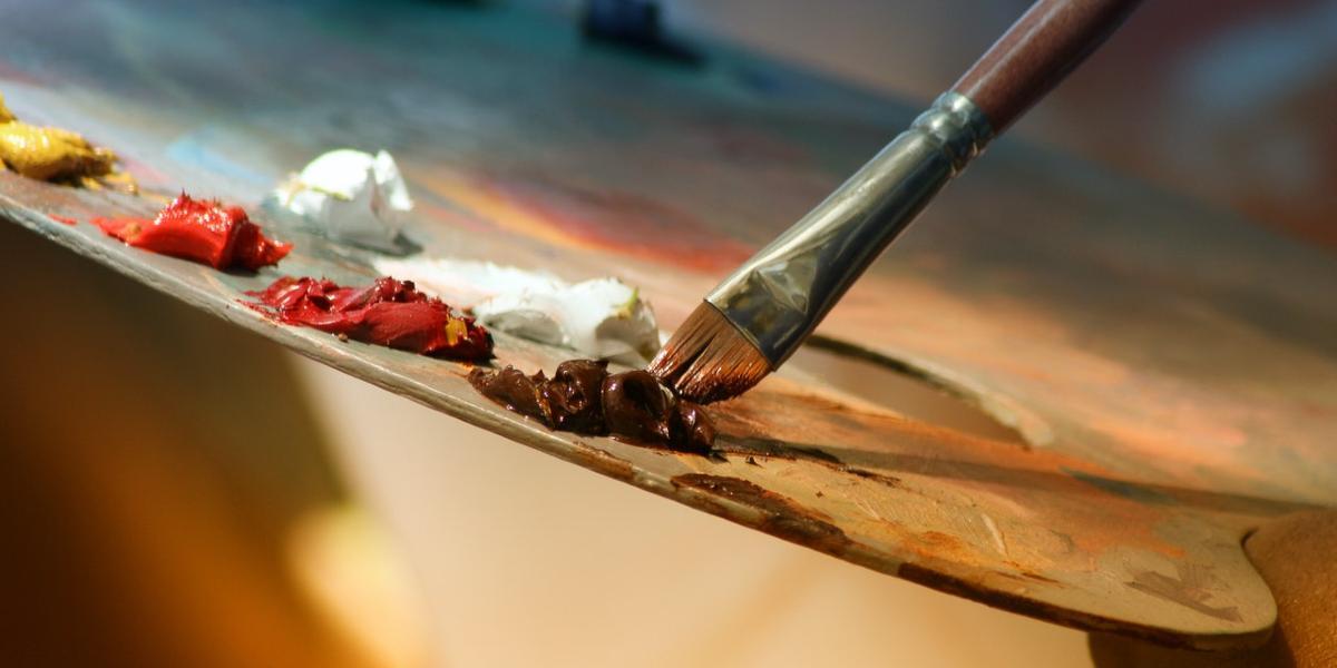 Main image Preston Art Society Close up of paintbrush being used on wooden pallet.