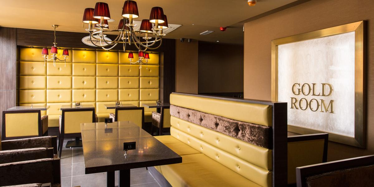 Main image: Haute Dolci Gold and maroon interior and seating inside Haute Dolci dessert house, Preston.