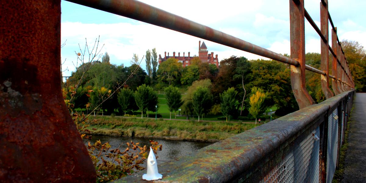 Preston spooky stores Small ghost figurine on bridge overlooking Miller Park on Autumn day