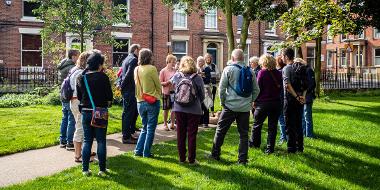 Group tour taking place in Winckley Square gardens.