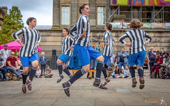 Dick, Kerr Ladies inspired performance on Preston Flag Market. Photo by Michael Porter Photography.