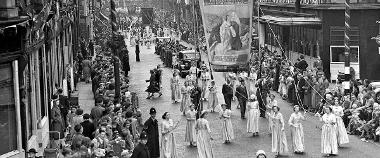 Women walking with banner in former Preston Guild procession. 
