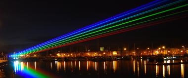 Rainbow laser light display in the sky at Preston Docks for Guild 2012 celebration.