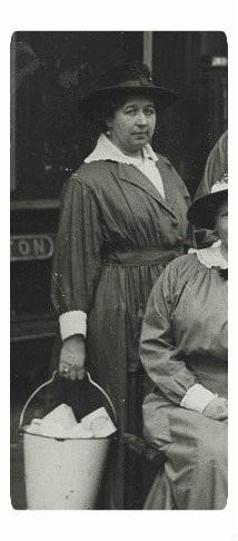 Beatrice Blackhurst stood on Preston Train Station platform holding bucket.